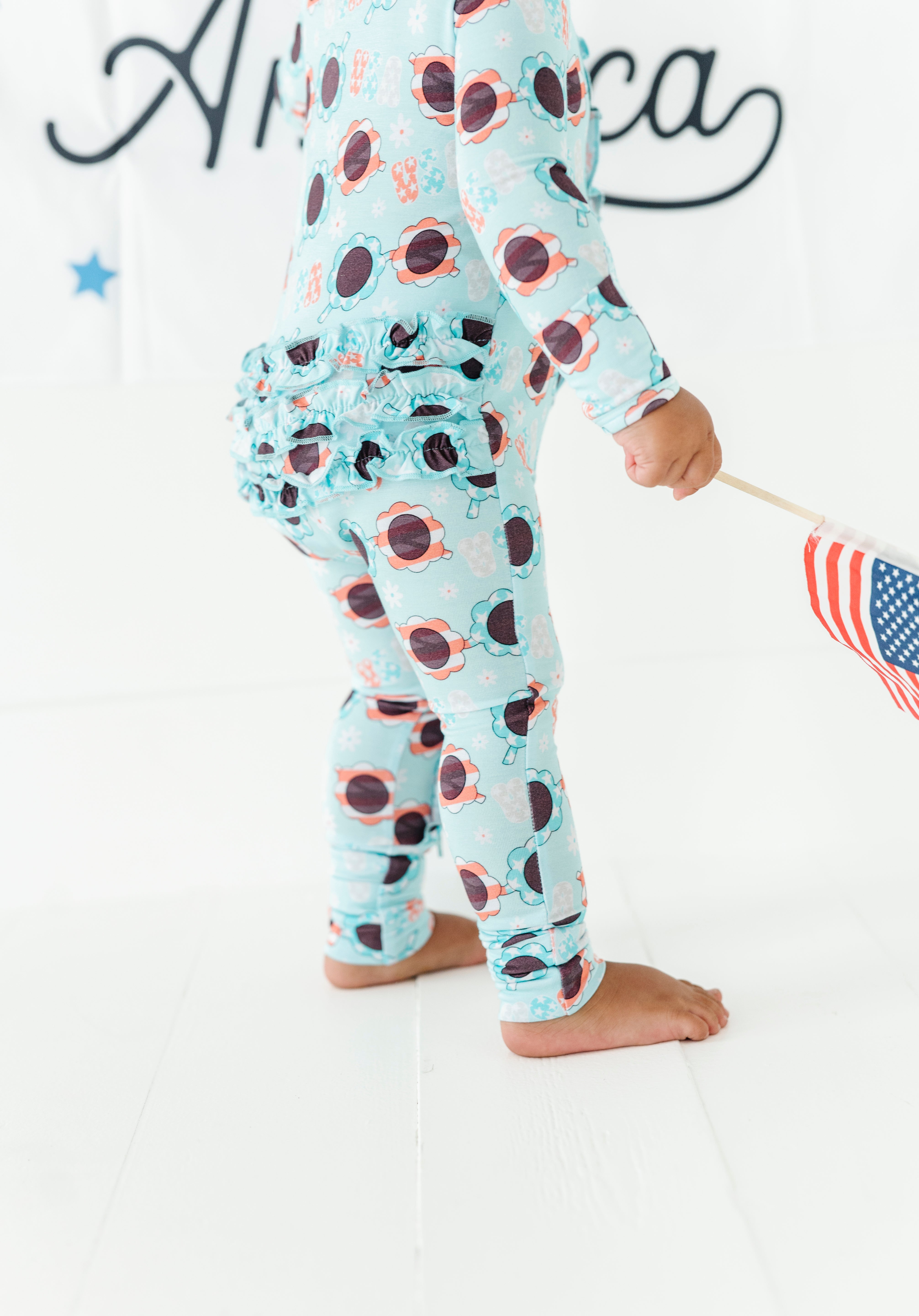 USA Sunglasses Ruffled Zipper Onesie