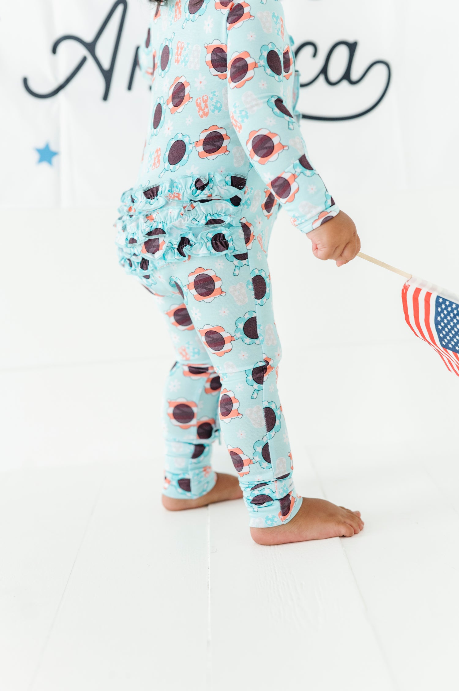 USA Sunglasses Ruffled Zipper Onesie